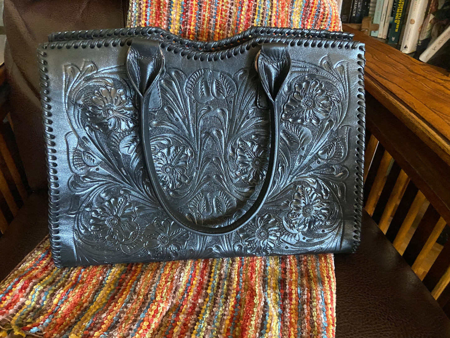 Cheyenne handmade tooled leather purse black front